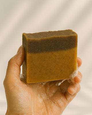 Coffee soap creating rich creamy lather during wash